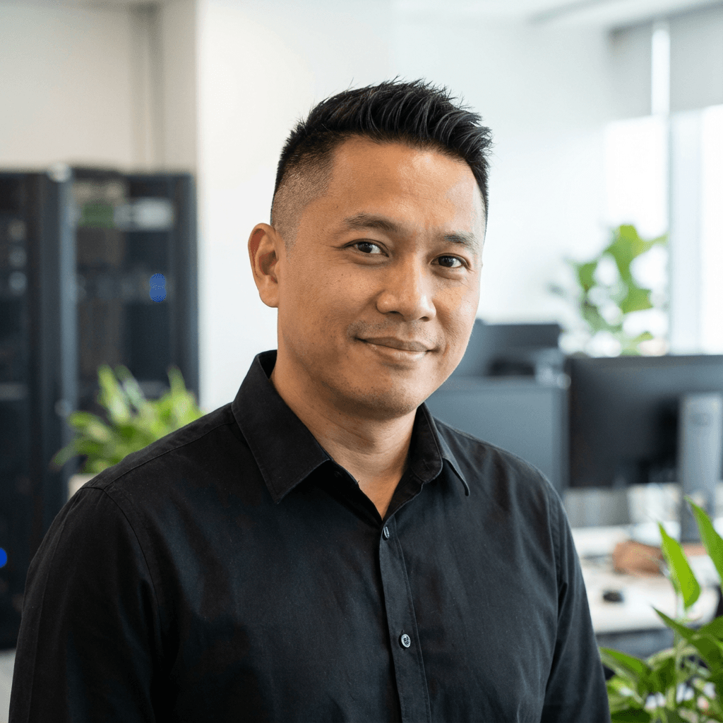 Male software developer in his early 30s, white, working at a modern desk